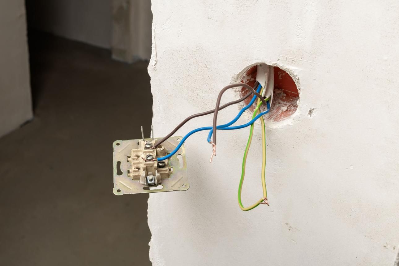 Electrical wiring being installed in a wall during construction
